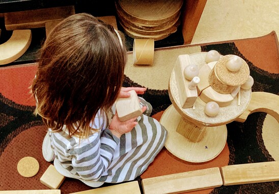 Student playing with blocks